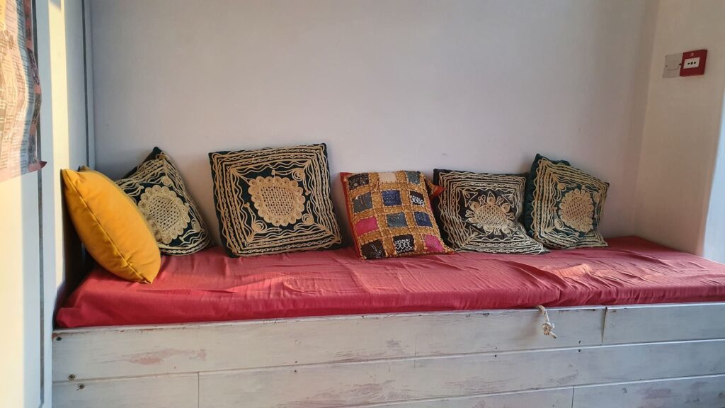 Yoga room reception with colourful pillows